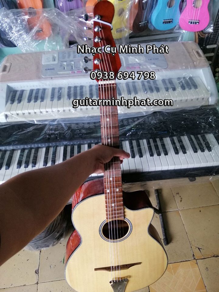 Hình ảnh chi tiết mặt top đàn guitar vọng cổ VC-100 all solid cho âm thanh vang thích hợp cho người mới tập chơi 