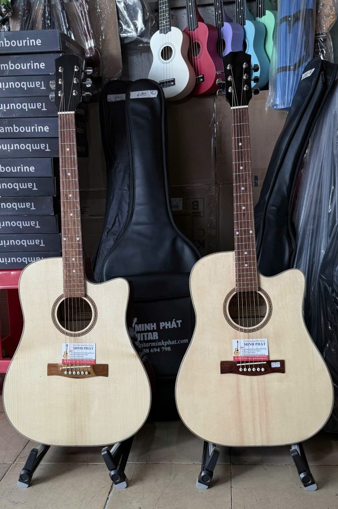 Tổng thể cây đàn guitar acoustic dáng D khuyết giá rẻ cho người mới tập chơi